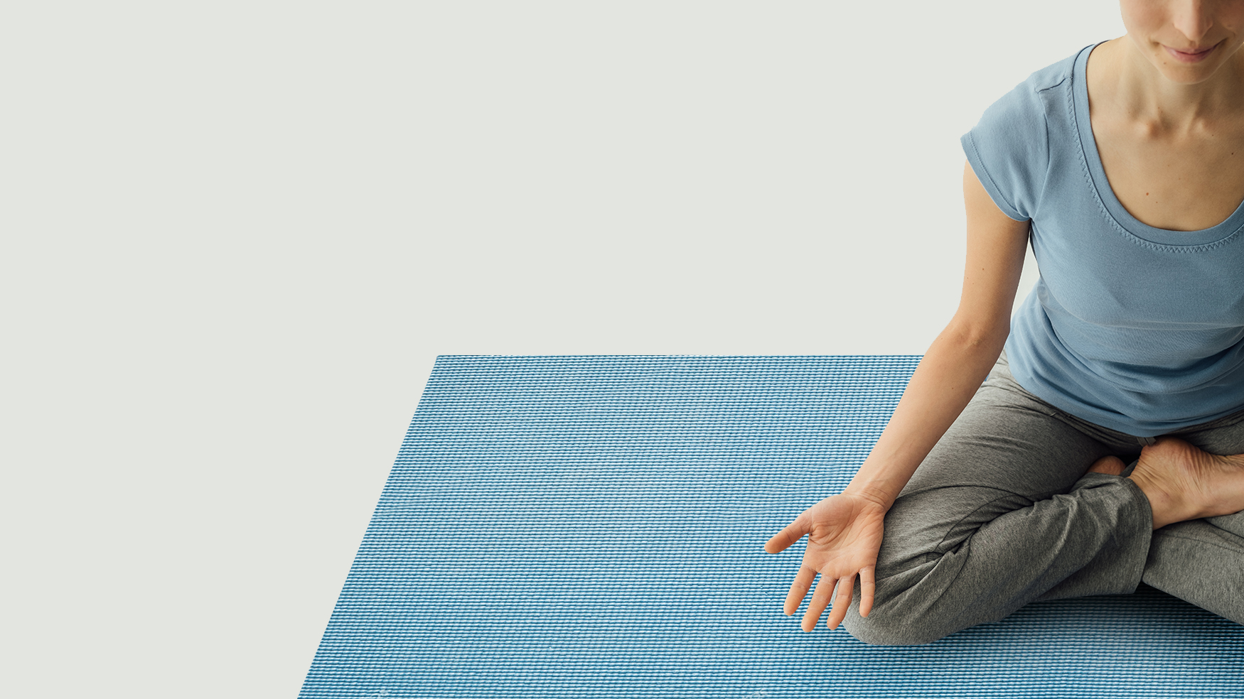 Woman practicing yoga at home